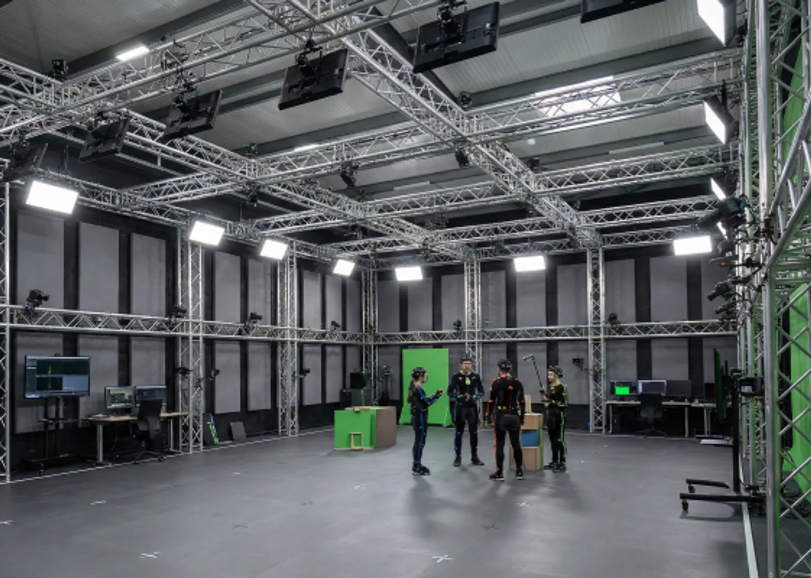 A large, professional motion capture studio with many cameras.